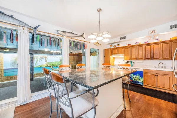 a kitchen with a table chairs and microwave