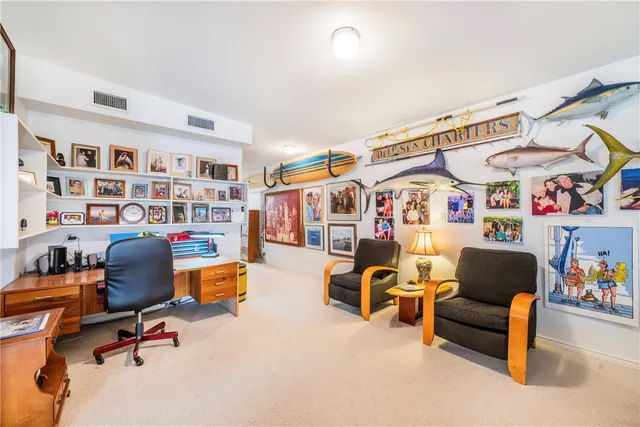 a white bath tub sitting next to a white cabinet