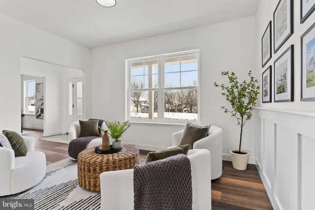 a kitchen with stainless steel appliances granite countertop a dining table and chairs
