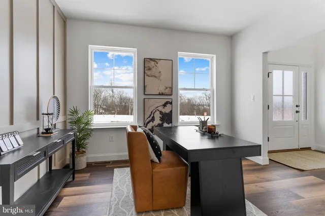 a kitchen with stainless steel appliances kitchen island granite countertop a table chairs a sink dishwasher window and cabinets