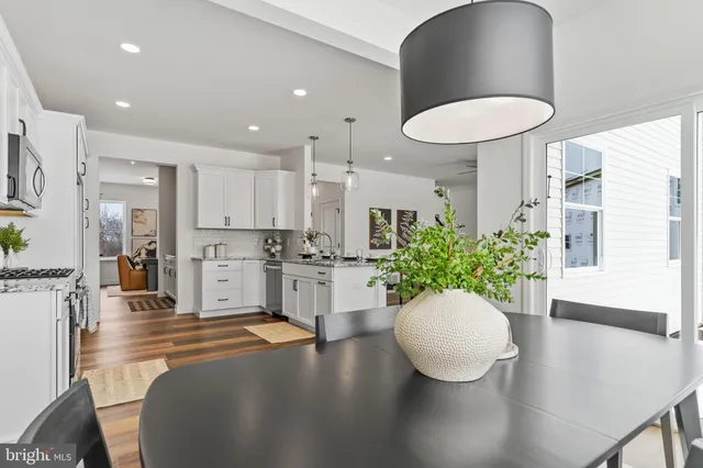 a living room with furniture a window and a fireplace