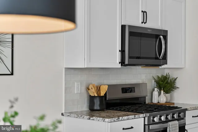 a bathroom with a shower sink and mirror