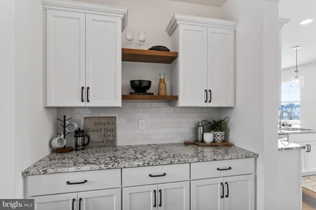 a bathroom with double vanity sinks and a mirror