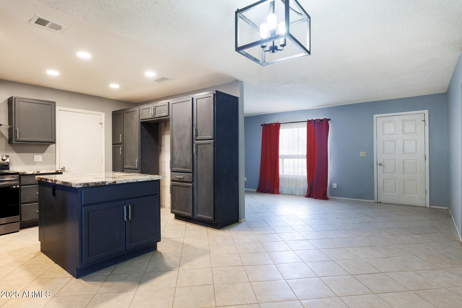 14169 South Tampico Road Arizona City, AZ 85123 - Photo 12 of 38 a kitchen with stainless steel appliances granite countertop a refrigerator and a sink