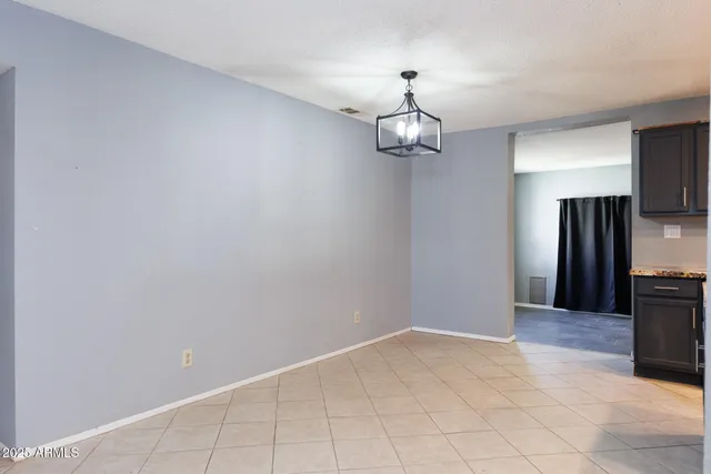 a view of a livingroom with a kitchen