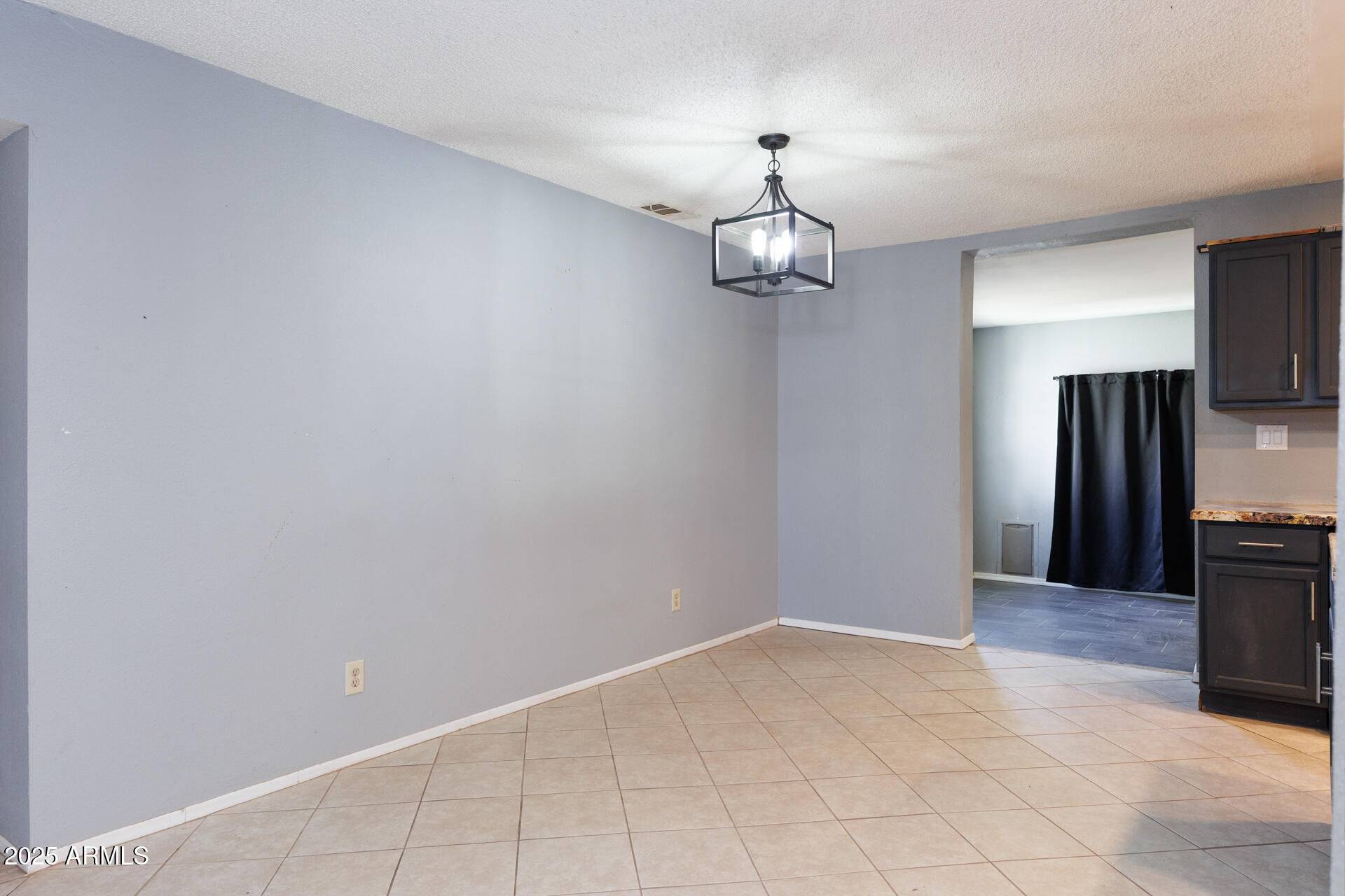 14169 South Tampico Road Arizona City, AZ 85123 - Photo 13 of 38 a view of a livingroom with a kitchen