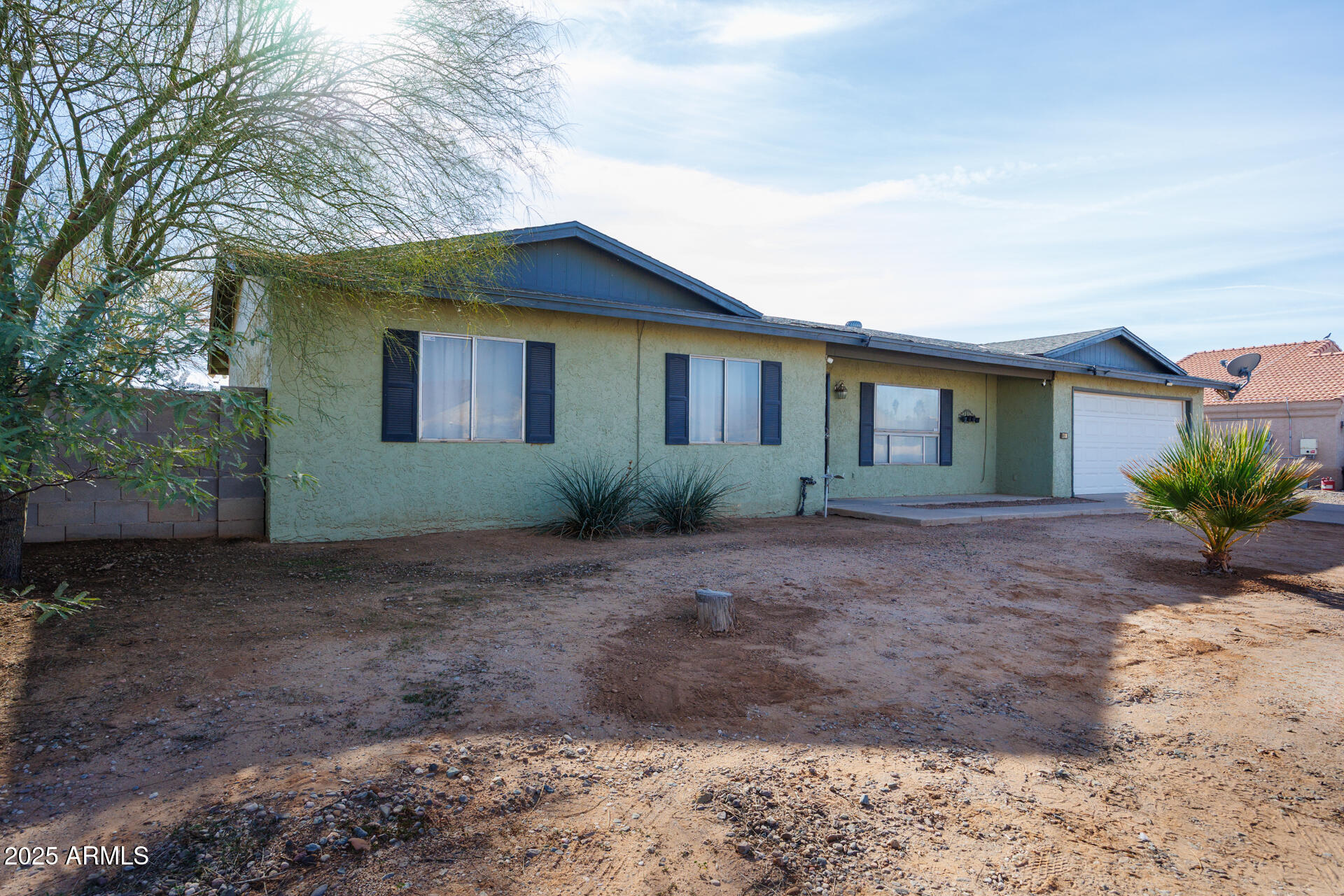 14169 South Tampico Road Arizona City, AZ 85123 - Photo 2 of 38 a view of a house with a yard and tree