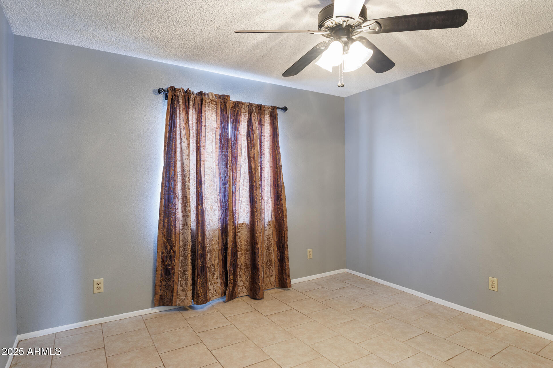 14169 South Tampico Road Arizona City, AZ 85123 - Photo 21 of 38 an empty room with closet and a chandelier fan