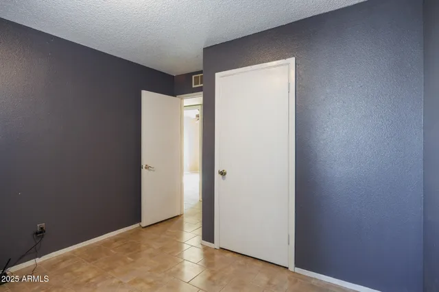 a view of a room with a wooden door