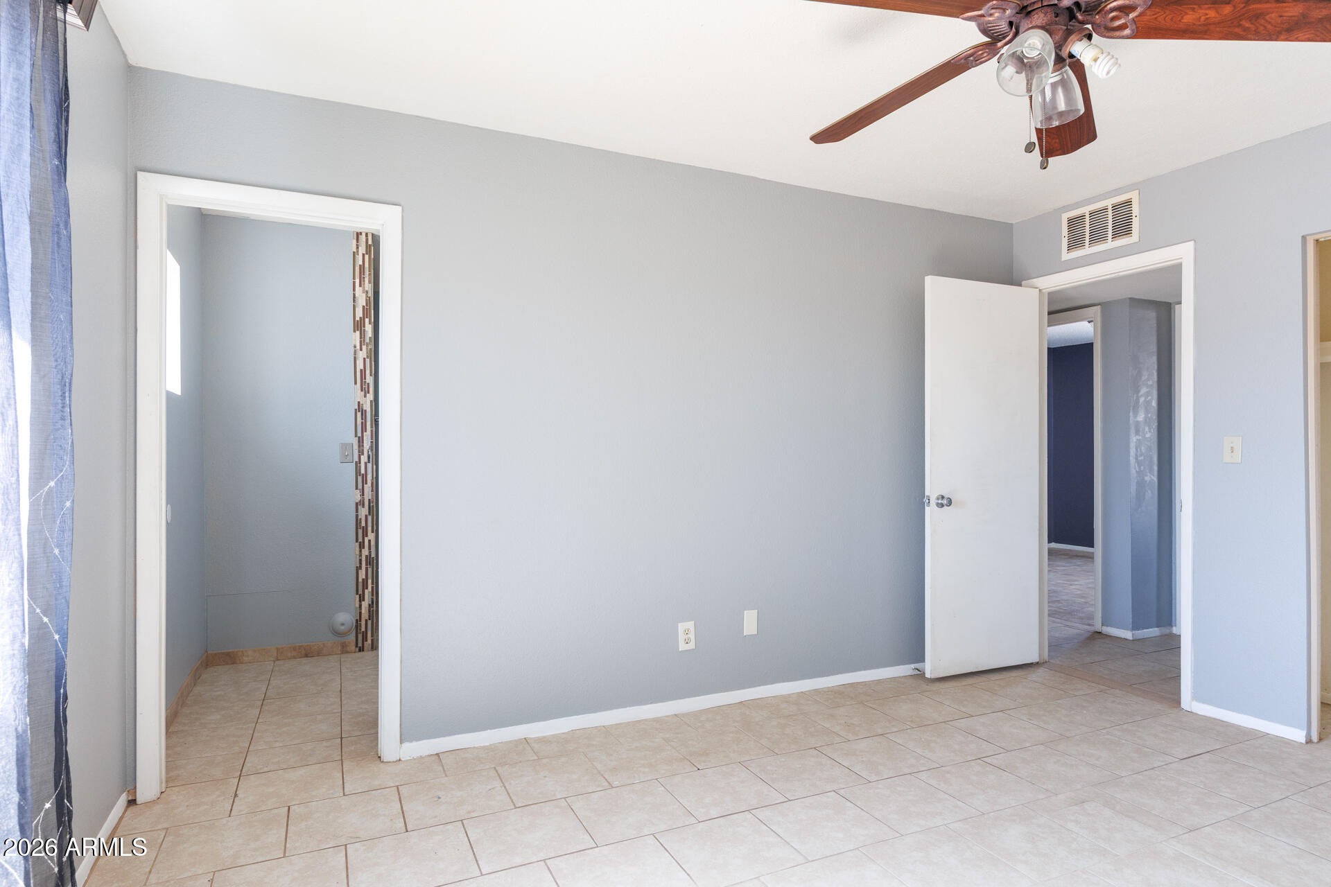 14169 South Tampico Road Arizona City, AZ 85123 - Photo 24 of 38 a view of an empty room with a chandelier fan
