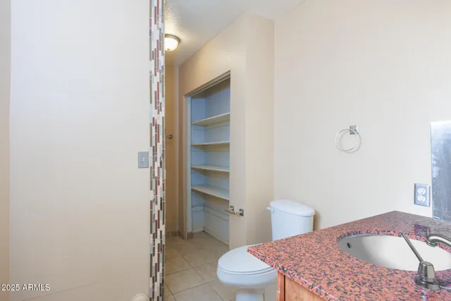 a bathroom with a glass shower door