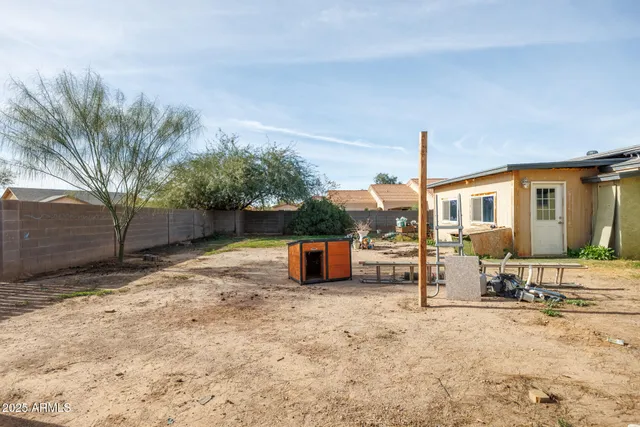 a view of a backyard of the house