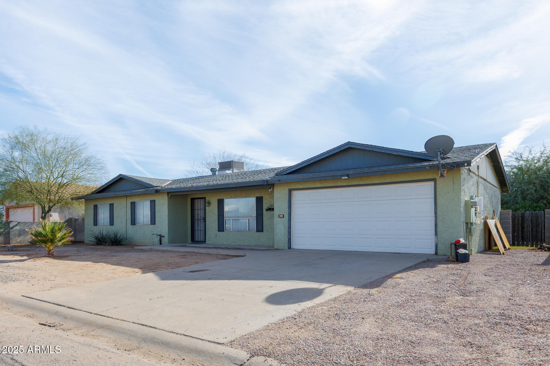 14169 South Tampico Road Arizona City, AZ 85123 - Photo 3 of 38 a front view of a house with a yard and garage