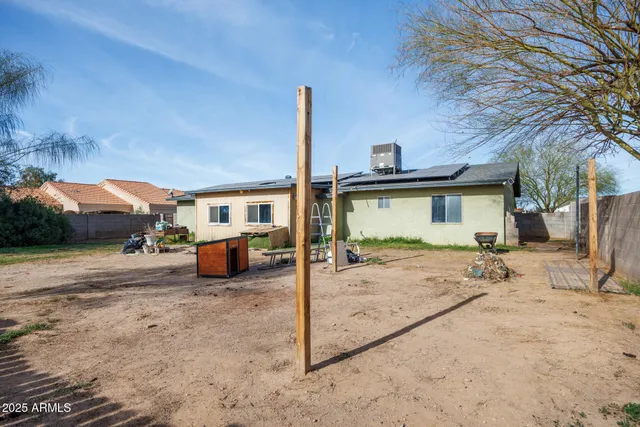 a view of a backyard of the house