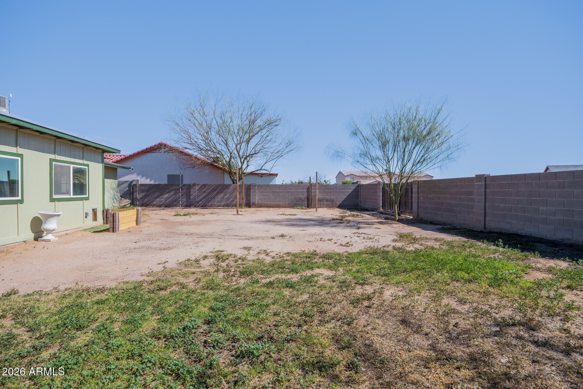 14169 South Tampico Road Arizona City, AZ 85123 - Photo 37 of 38 a house view with a backyard space