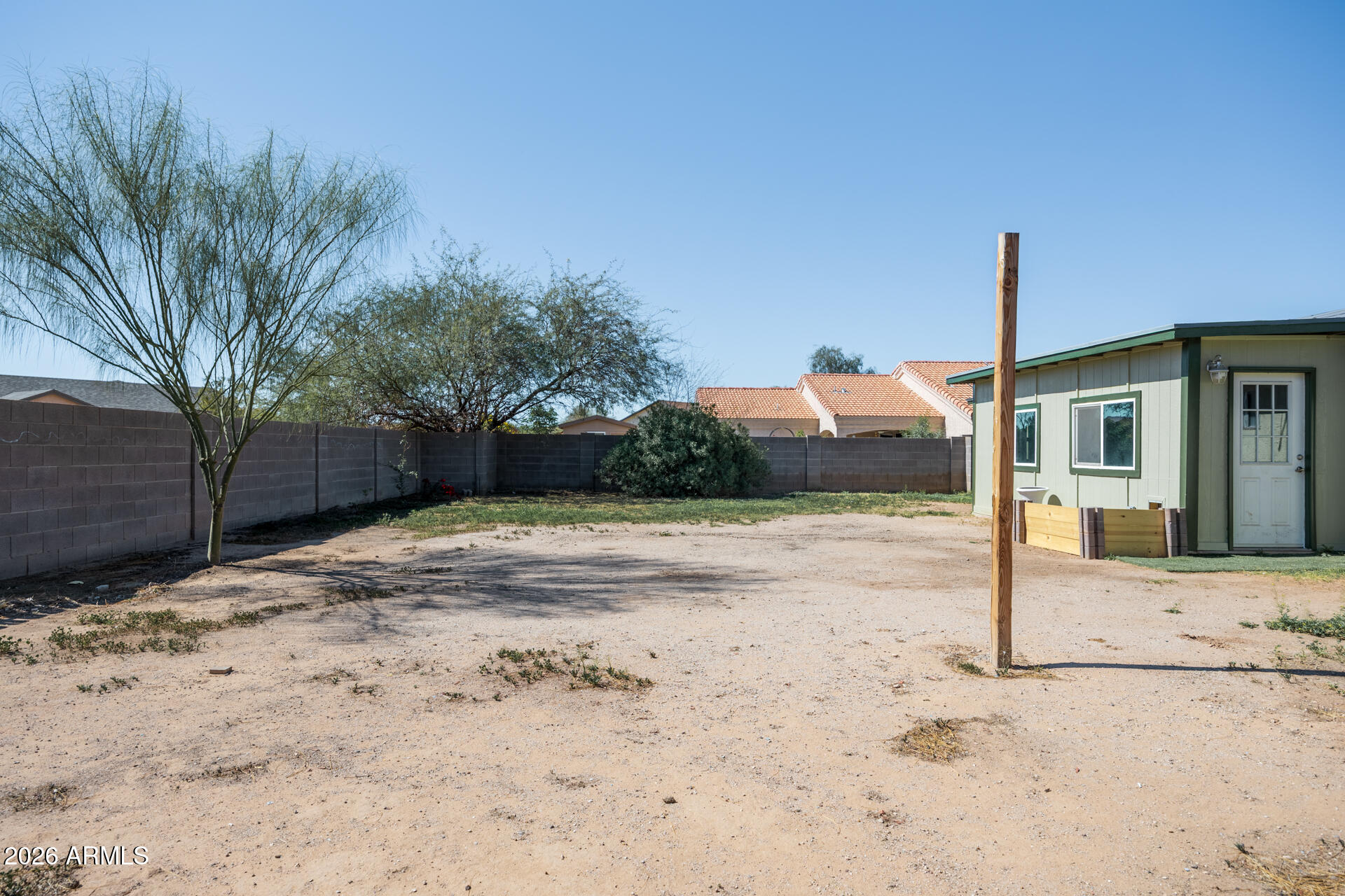 14169 South Tampico Road Arizona City, AZ 85123 - Photo 38 of 38 a view of a house with wooden fence
