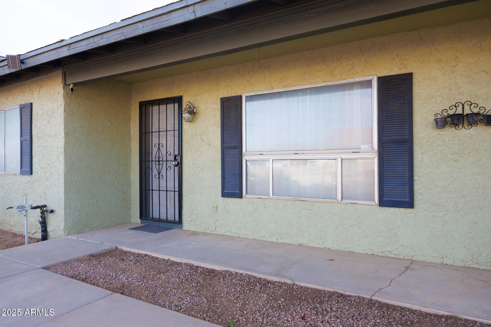 14169 South Tampico Road Arizona City, AZ 85123 - Photo 4 of 38 a view of an empty room with a window