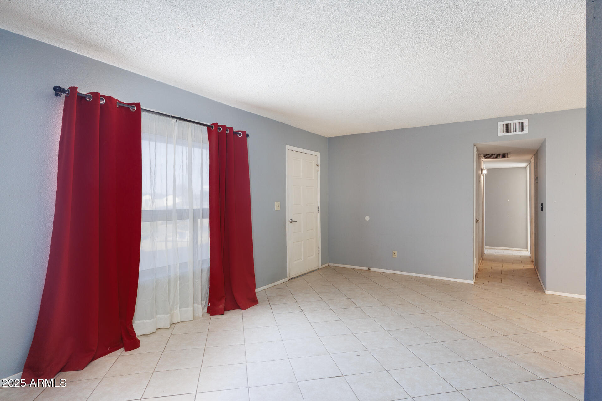 14169 South Tampico Road Arizona City, AZ 85123 - Photo 5 of 38 a view of a room with red walls and a window