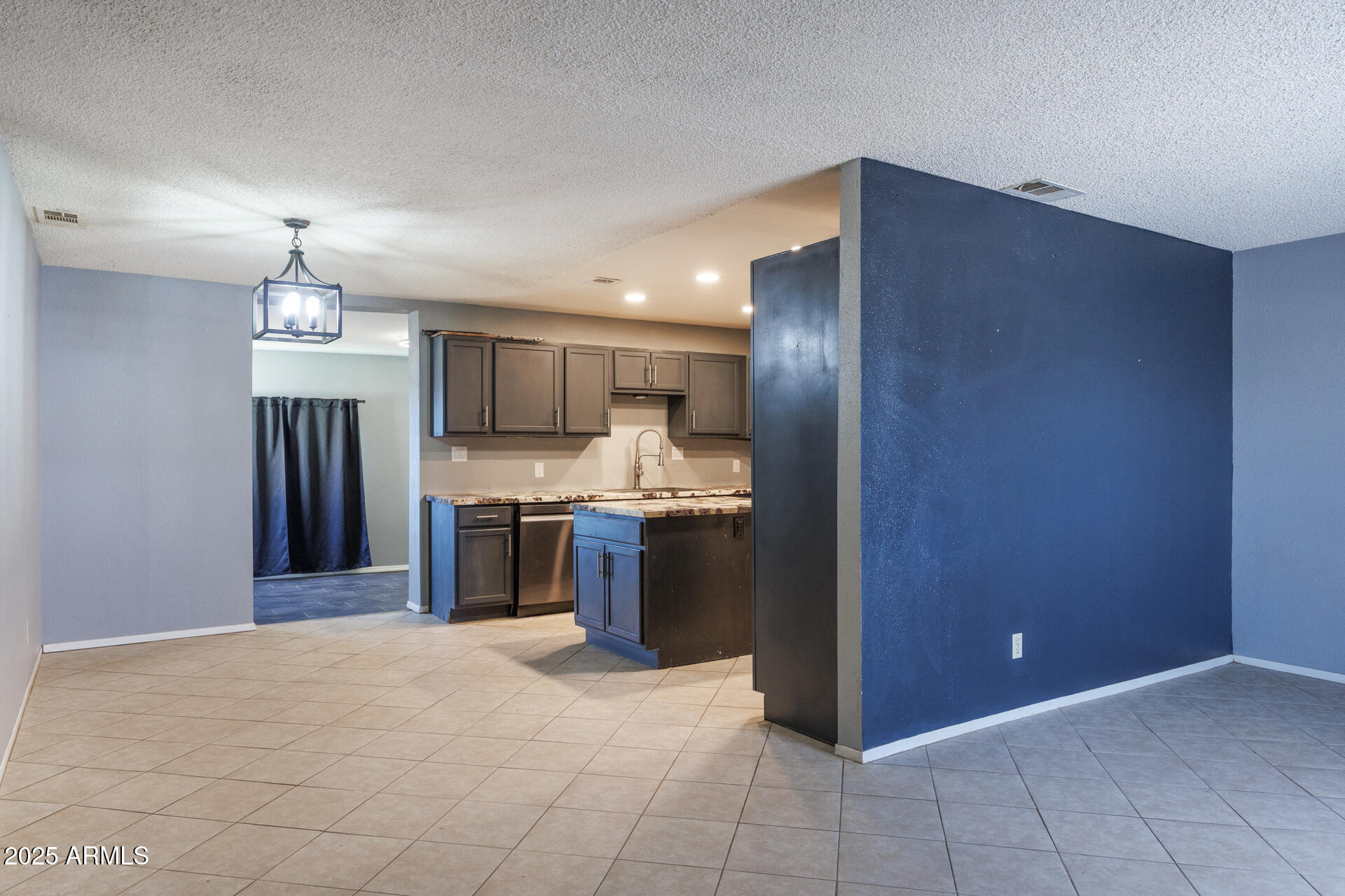 14169 South Tampico Road Arizona City, AZ 85123 - Photo 7 of 38 a kitchen with stainless steel appliances granite countertop a refrigerator and a sink