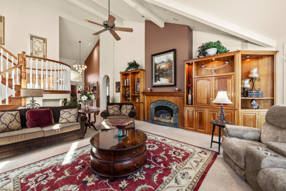 11629 Merganser Road Klamath Falls, OR 97601 - Photo 11 of 50 a living room with furniture a rug and a fireplace