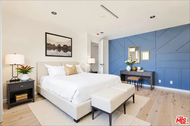 a bedroom with a bed and a table in it