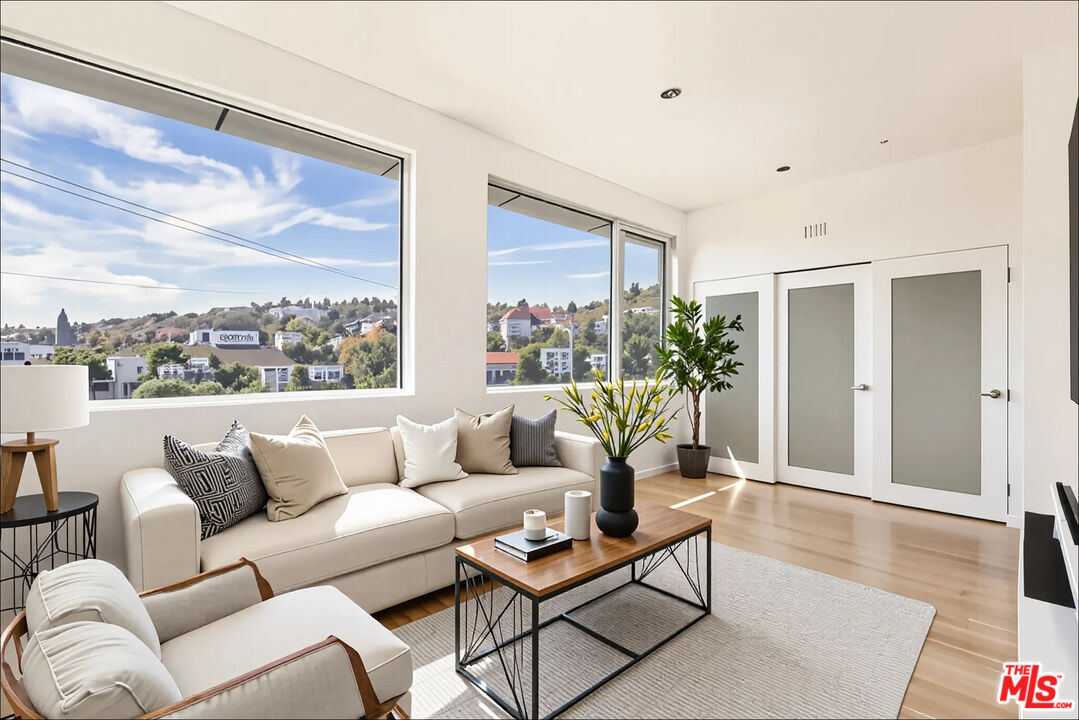 1610 Viewmont Drive Los Angeles, CA 90069 - Photo 16 of 22 a living room with furniture and a large window