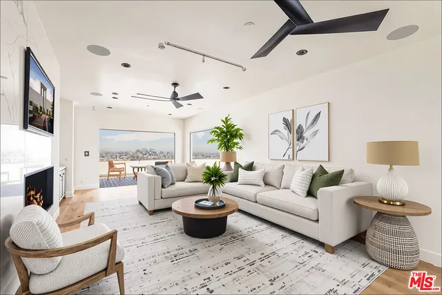 a living room with furniture fireplace and a flat screen tv