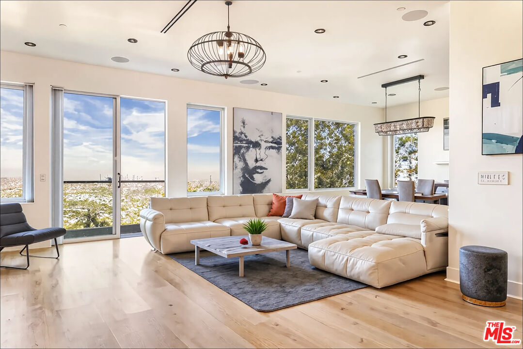 1610 Viewmont Drive Los Angeles, CA 90069 - Photo 4 of 22 a living room with furniture and a large window