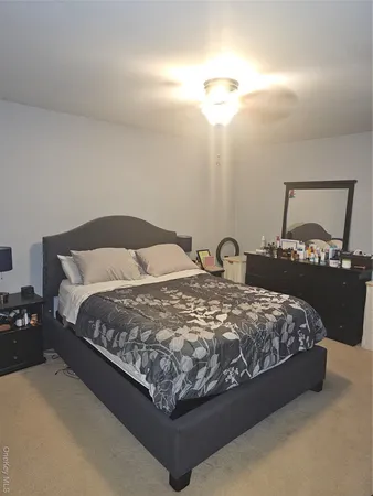 a bedroom with a bed and furniture