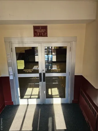 a view of living room with furniture and a fireplace
