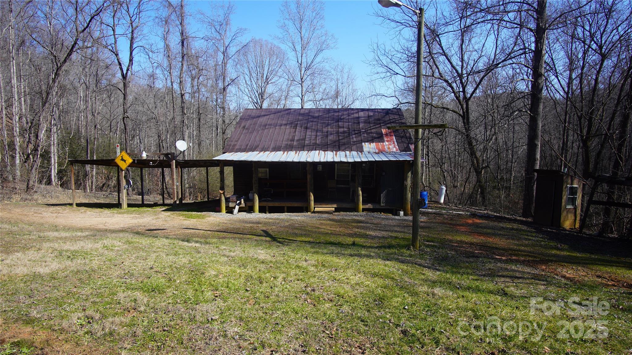 0 Vannoy Ridge Road Moravian Falls, NC 28654 - Photo 2 of 41 a front view of a house with a yard