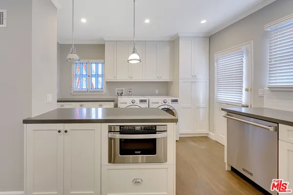 a kitchen with a stove and a sink