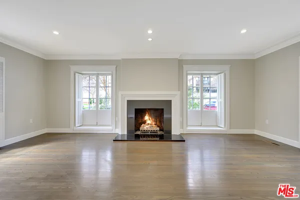 a view of a room with window and a fireplace