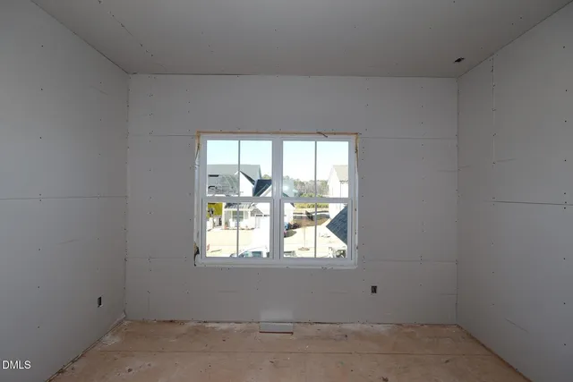 a view of a big room with windows