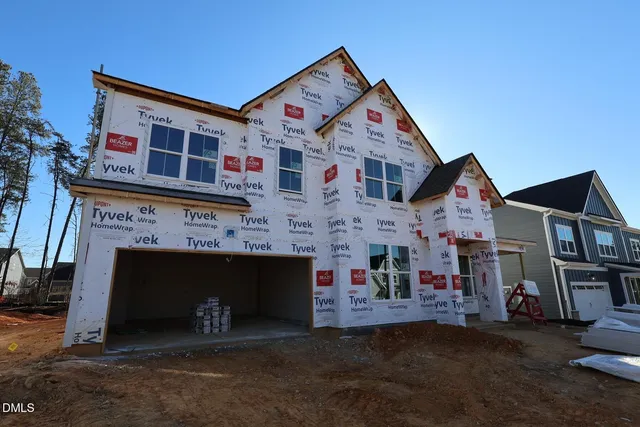 a front view of a building with many windows