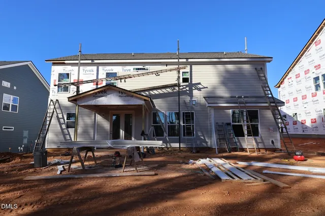 a front view of a house with a street