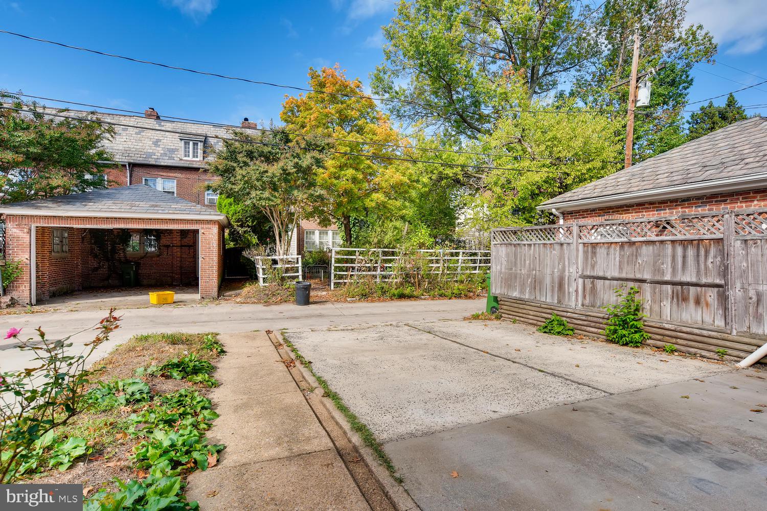 3610 Greenmount Avenue Baltimore, MD 21218 - Photo 21 of 24 a front view of a house with a yard and garage