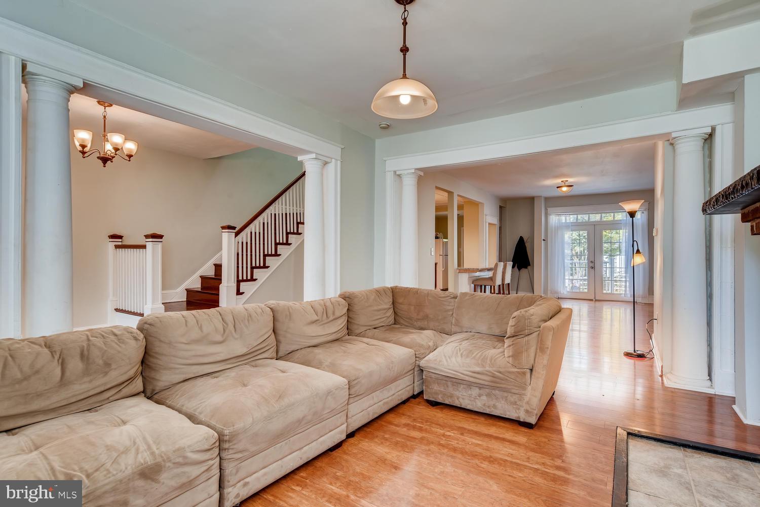 3610 Greenmount Avenue Baltimore, MD 21218 - Photo 4 of 24 a living room with furniture and a large mirror
