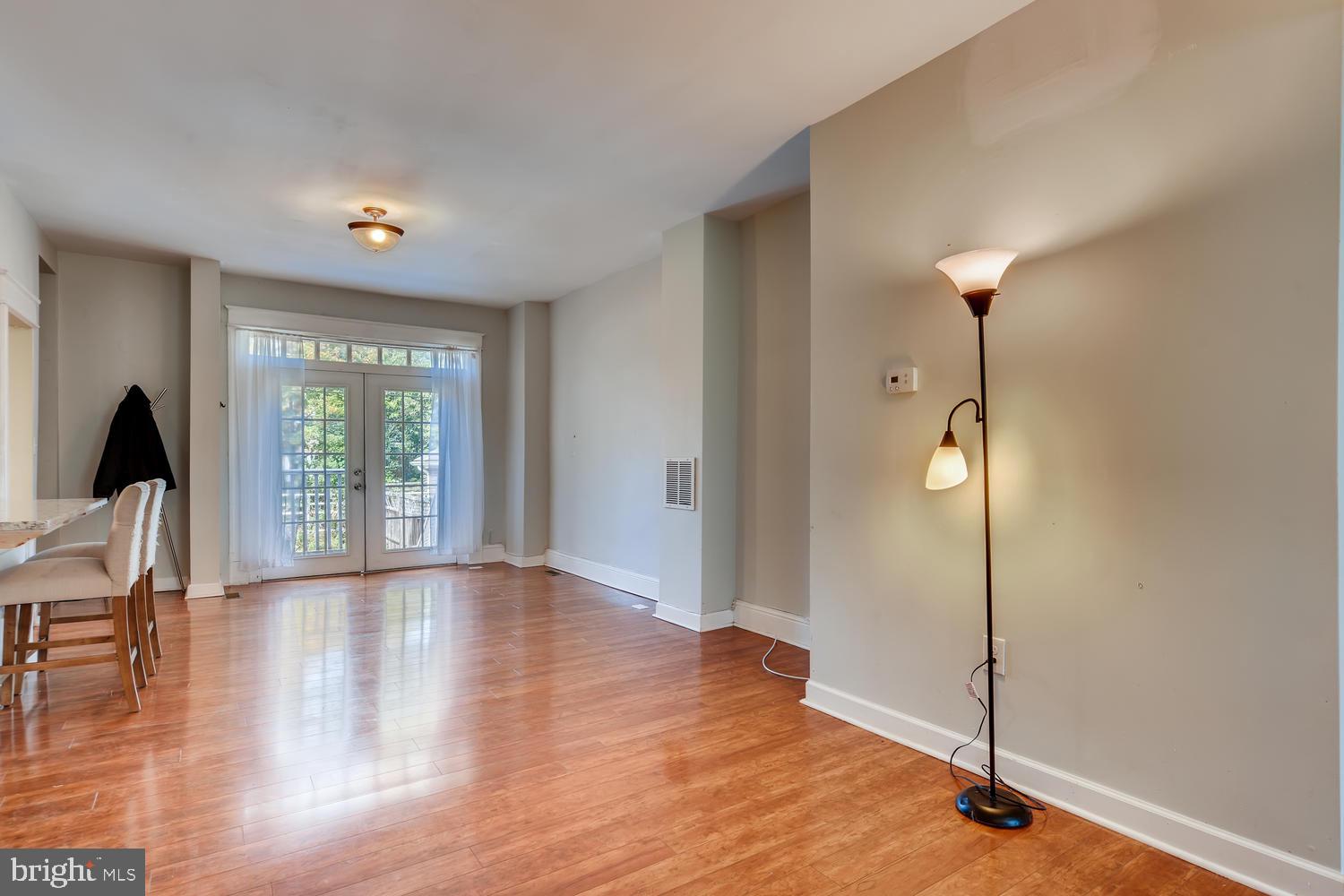 3610 Greenmount Avenue Baltimore, MD 21218 - Photo 5 of 24 a view of empty room with wooden floor and fan