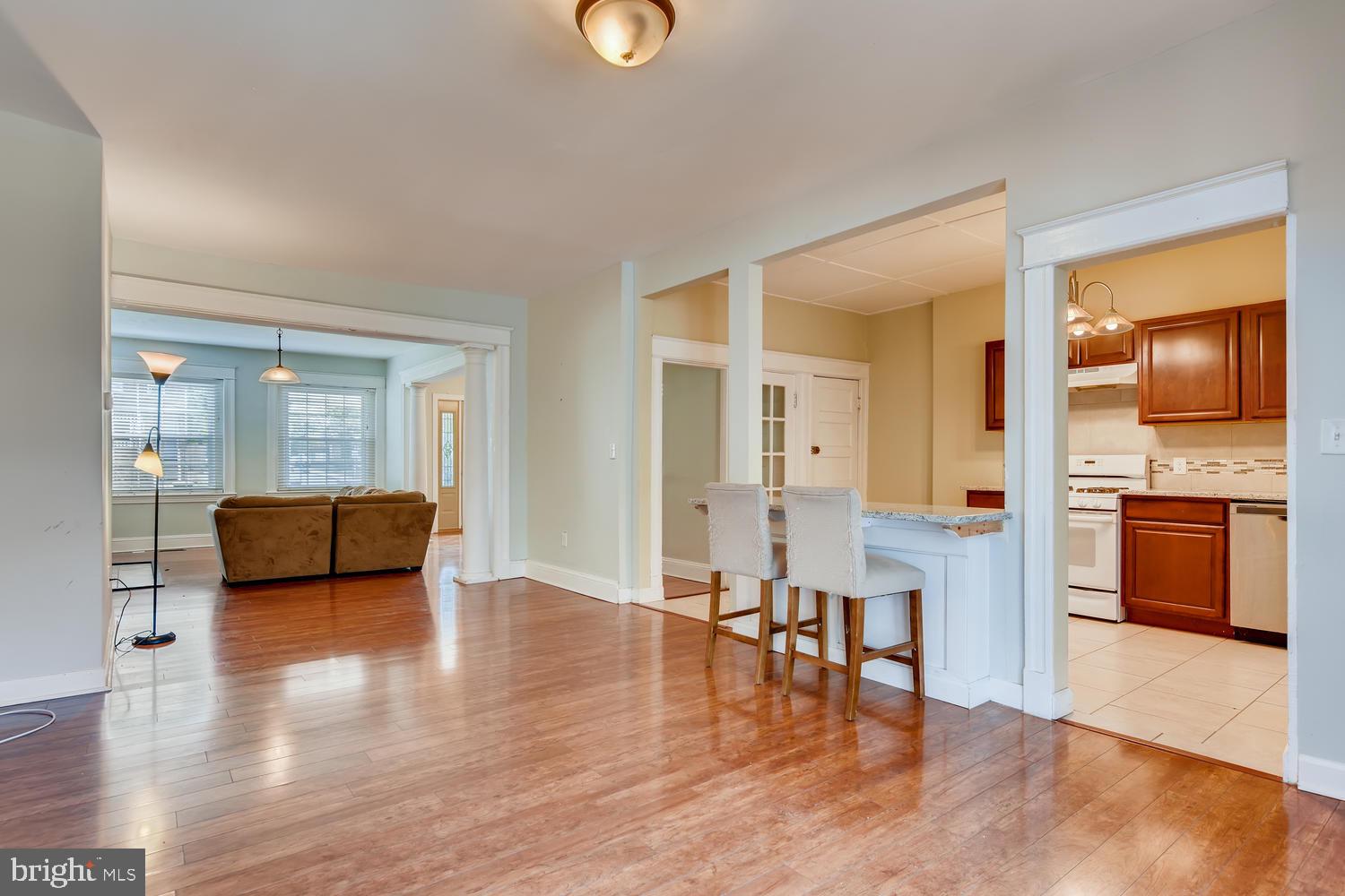 3610 Greenmount Avenue Baltimore, MD 21218 - Photo 6 of 24 a view of a living room a couch and a wooden floor