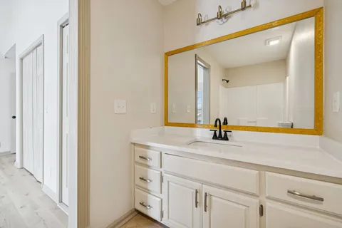 a bathroom with a sink and a mirror