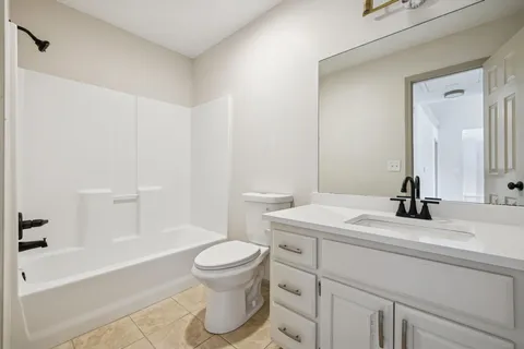 a bathroom with a sink a toilet and a bathtub