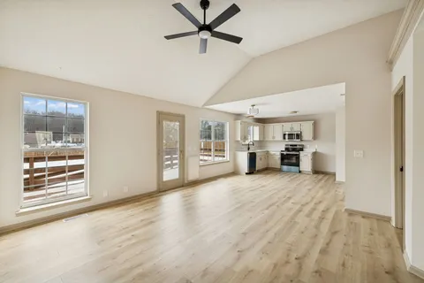 a view of livingroom with furniture and window