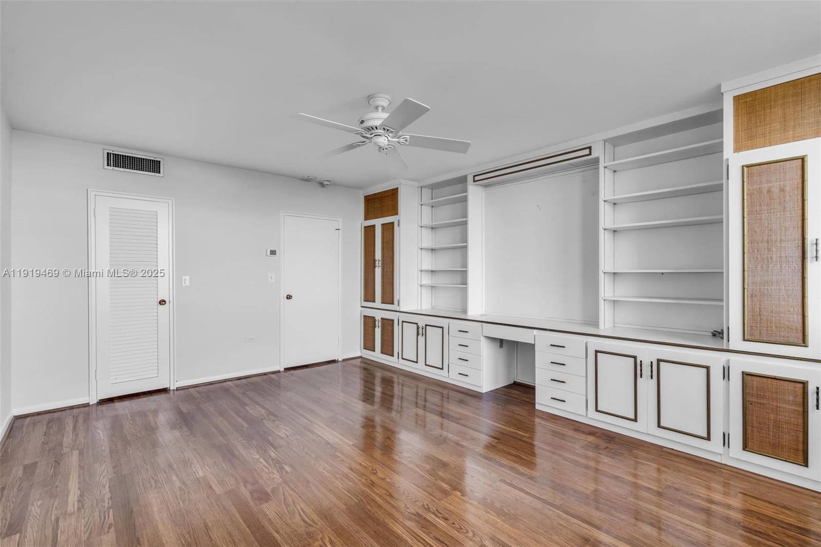 200 Ocean Ln Drive, Unit 407GR09 Key Biscayne, FL 33149 - Photo 19 of 56 a view of an empty room with wooden floor and a window