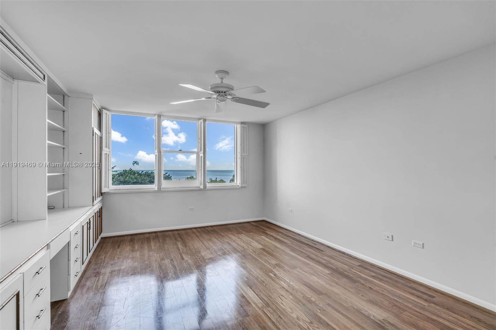 200 Ocean Ln Drive, Unit 407GR09 Key Biscayne, FL 33149 - Photo 21 of 56 a view of an empty room with a window and wooden floor