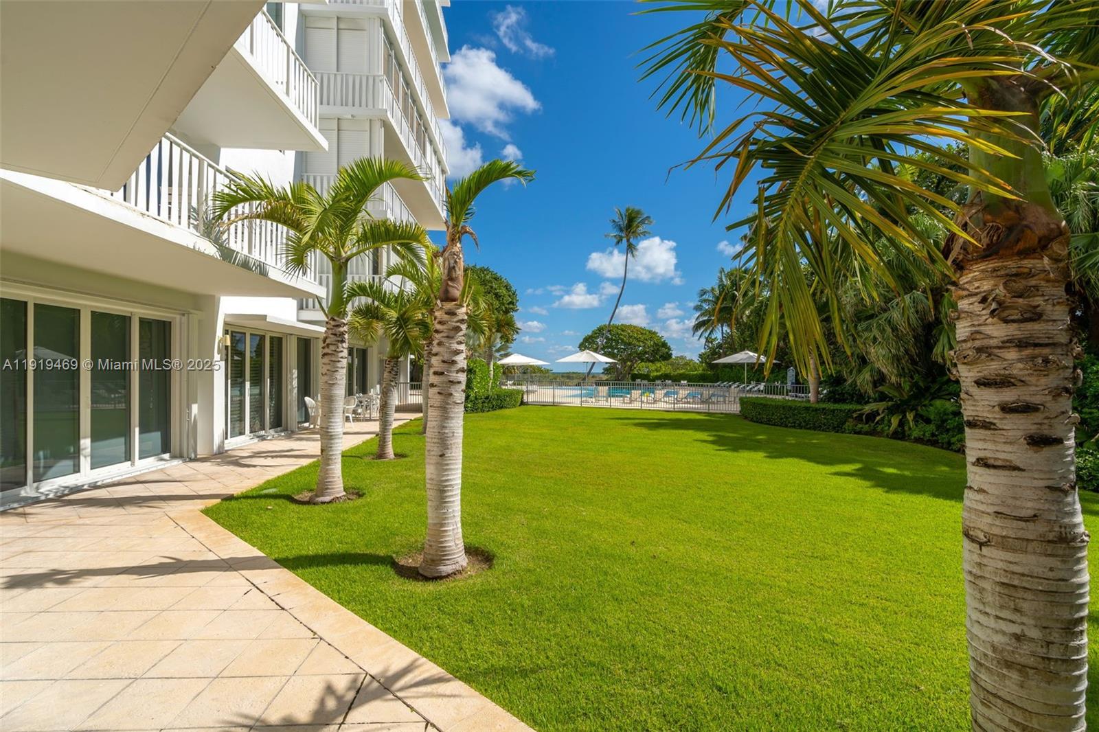 200 Ocean Ln Drive, Unit 407GR09 Key Biscayne, FL 33149 - Photo 23 of 56 a house with garden in front of it
