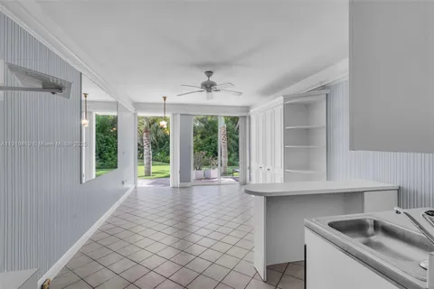 a view of a kitchen with wooden floor and a kitchen