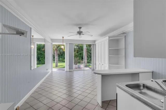 a view of a kitchen with wooden floor and a kitchen