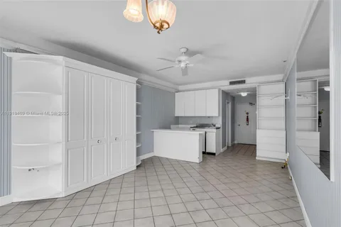 a kitchen with a cabinets and a stove top oven