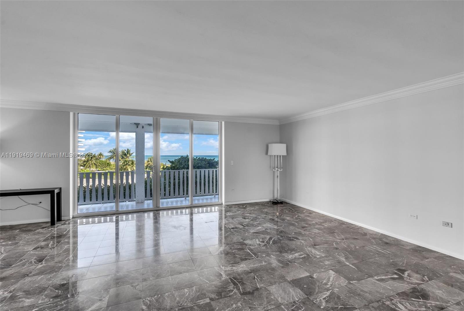 200 Ocean Ln Drive, Unit 407GR09 Key Biscayne, FL 33149 - Photo 3 of 56 an empty room with floor to ceiling window and wooden floor